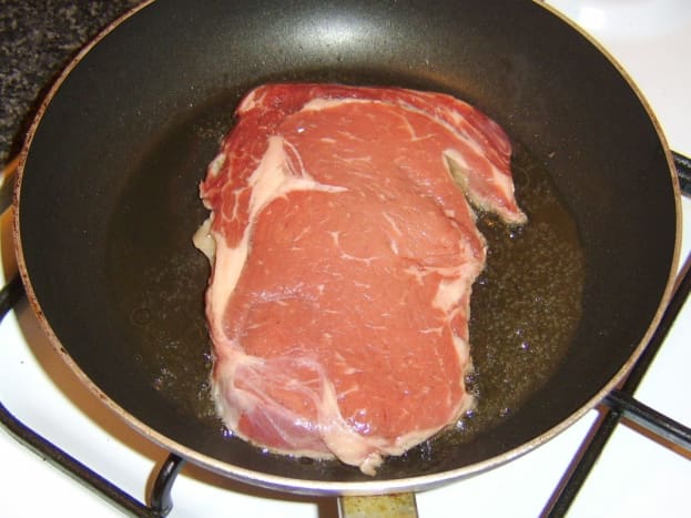 Starting to fry rib eye steak