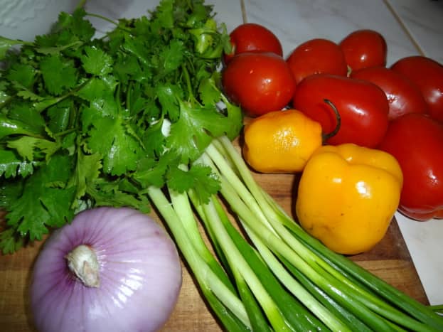 Start with onion, cilantro, tomatoes, garlic and hot peppers