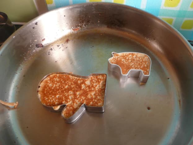 We used molds to make different shaped pancakes, like this mitten and pig.