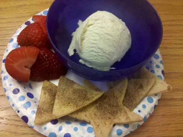 Our finished cinnamon nachos with fresh strawberries and a scoop of vanilla ice cream.