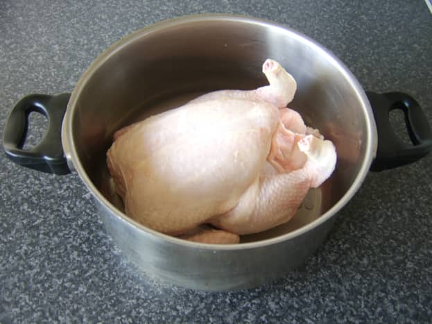 A large pot is needed to poach the chicken