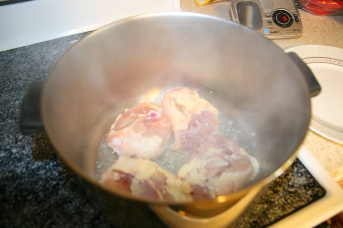 Braise the chicken thighs in a small amount of oil. Once braised, remove the chicken and cook the onions in the same pot. Add the broth mixture.