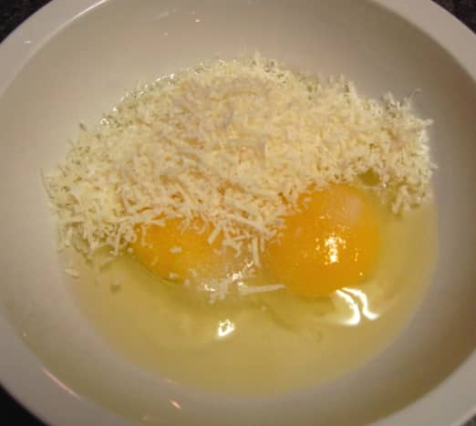 In a small bowl add the eggs, salt, pepper, and Parmesan cheese