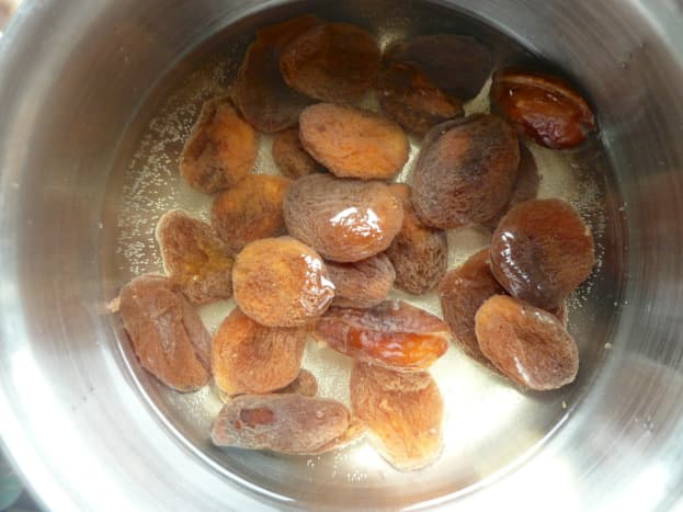 Place apricots in a pan with the water