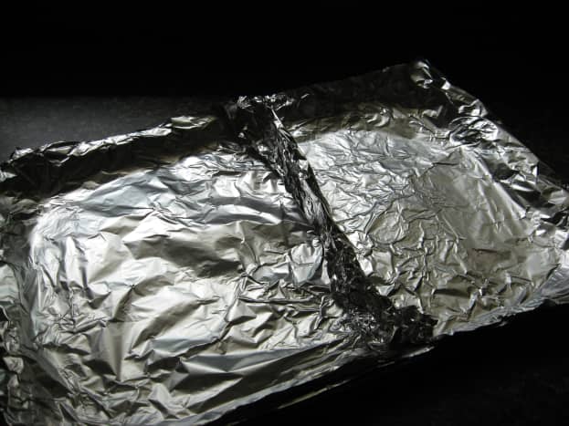 Use foil to make two sections in a large baking pan.