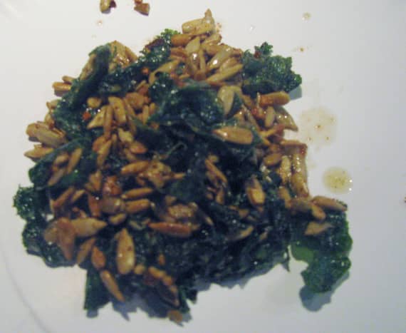 Sauteed radish greens with sunflower seeds. Red pepper flakes help to give it a spicy kick. 