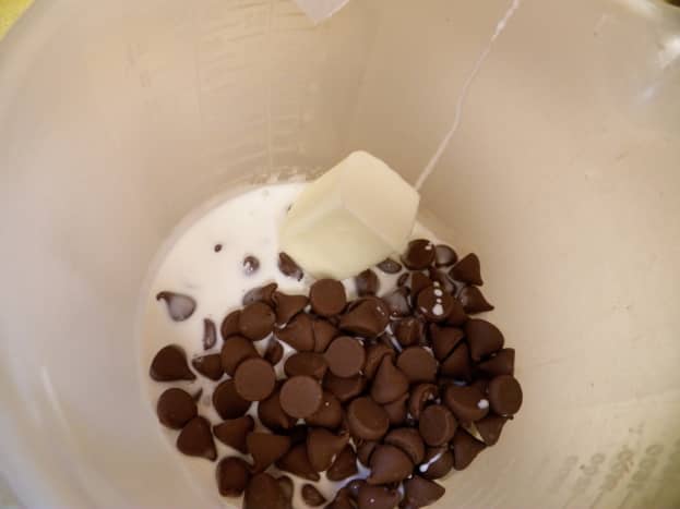 Step 1: Put 1/2 cup cream, 2 tablespoon, butter and 1 package of chocolate chips in bowl. Microwave 1 minute and stir.