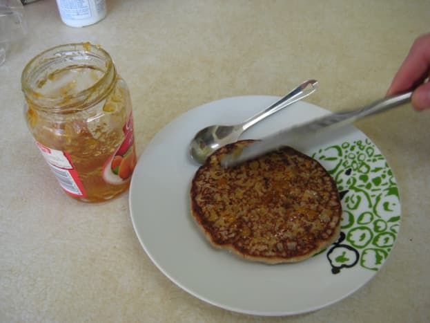 Spread on a generous amount of fruit jam or maple syrup.