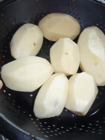 Peeled potatoes.  Rinsed &amp; ready to cut.