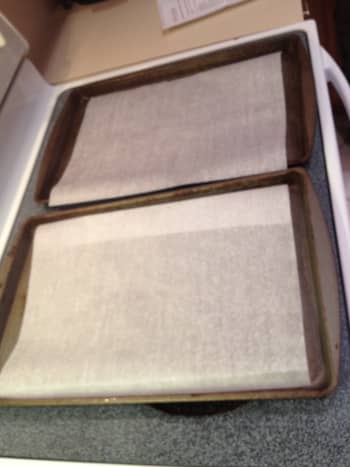 Line baking sheets with parchment paper. 
