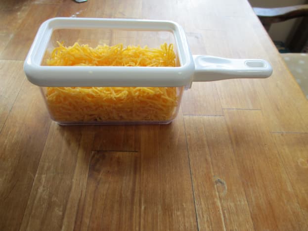 Grate about a cup of your favorite cheese.