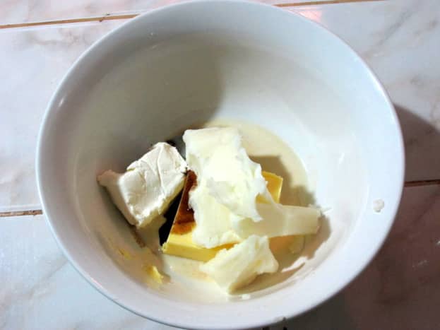 Place butter and vanilla in a large mixing bowl.