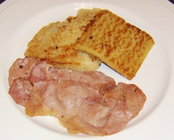 Potato and soda farls are plated with bacon