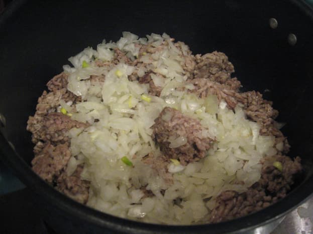 Cook ground beef and onion.