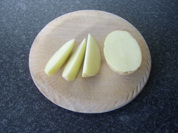 Potato is cut in to six segments or wedges