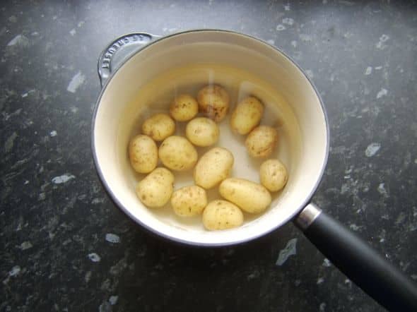Potatoes are parboiled in their skins