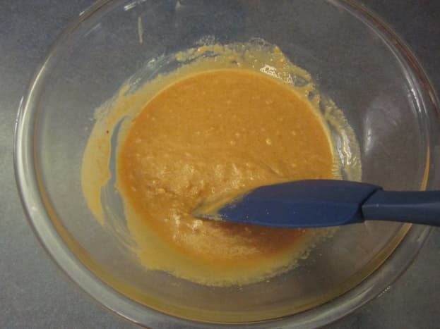 Step 2: Stir peanut butter and oil together in a bowl. Add the brown and white sugars and blend until well combined.