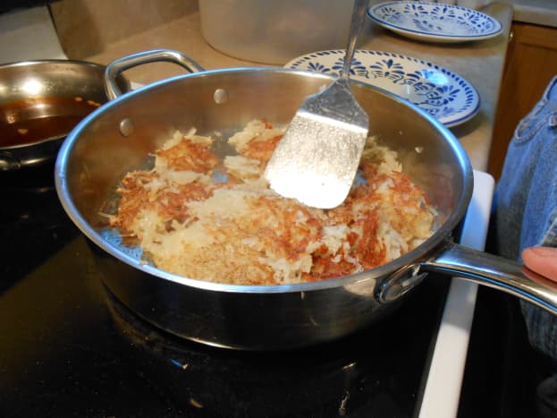 Carefully place your spatula under hash browns.