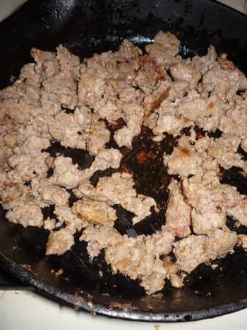 Brown 1 pound of breakfast sausage in a skillet.  Do NOT drain the drippings.  You'll need it for the next step.