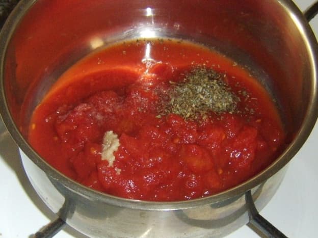 Preparing a simple tomato sauce for plaice and pasta bake