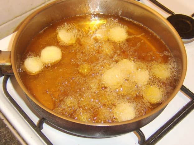 Deep frying cooled potato halves