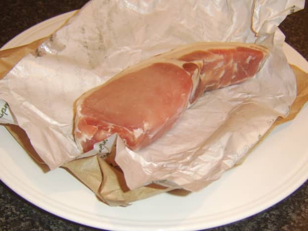 Unwrapping back bacon steak