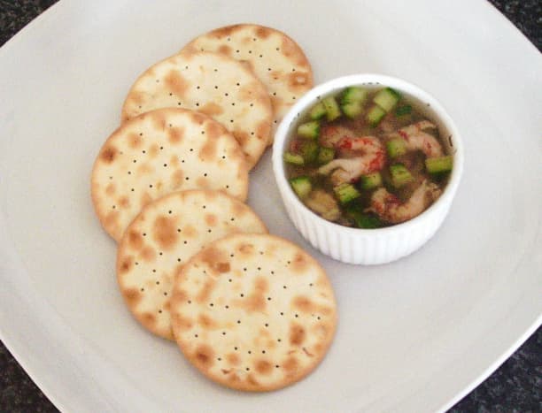 Cucumber and dill potted crayfish tails are served simply with water biscuit crackers