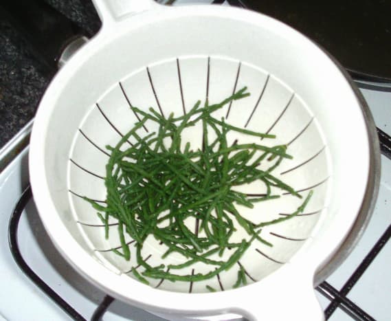 Blanched samphire is drained and left to cool slightly