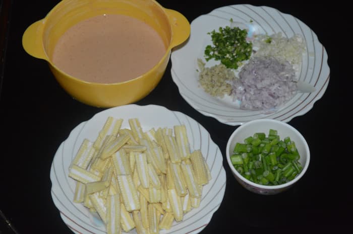 The batter and other ingredients for making baby corn Manchurian