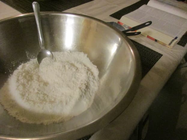 Combine flour, baking powder, 2 tablespoons sugar, and salt.