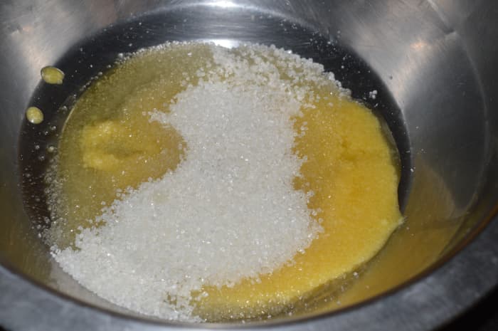 Step one: In a bowl, mix ghee, sugar, and water.