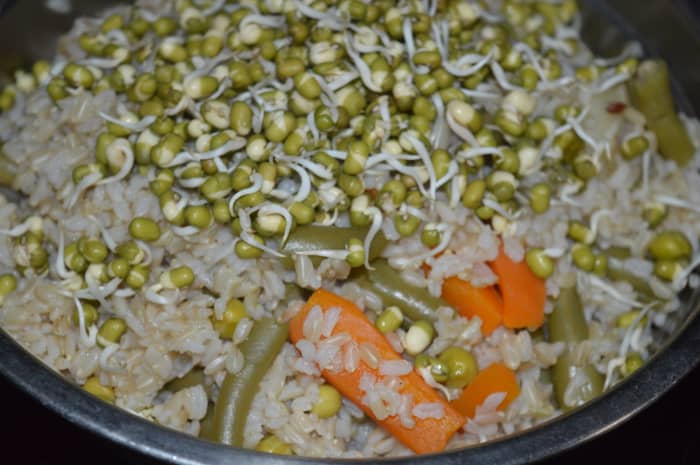 Step one: Cook brown rice, carrot, peas and French beans for 12 minutes in a cooker.  Then add mung bean sprouts. 