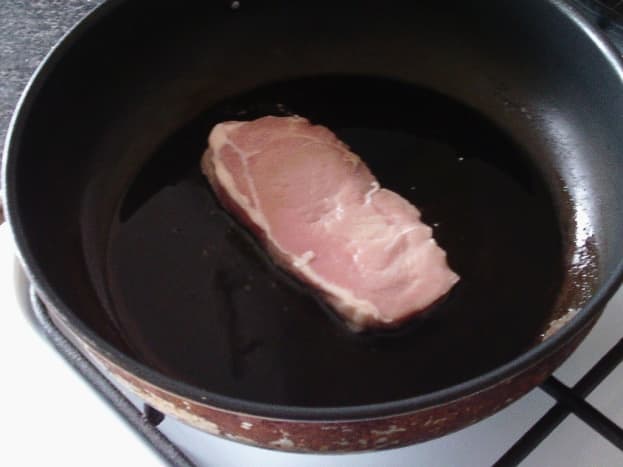 Pork steak is gently fried in a little oil