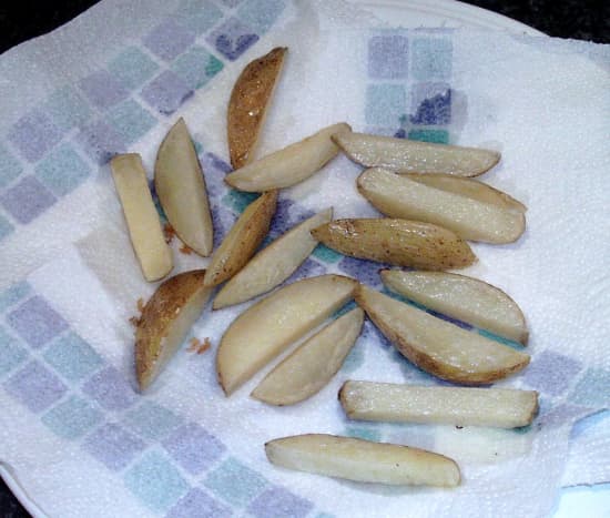 Once fried chips are drained on kitchen paper