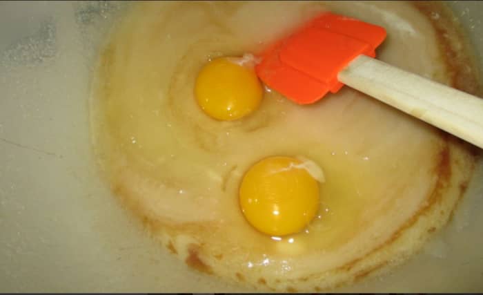 Add the eggs to the sugar mix.