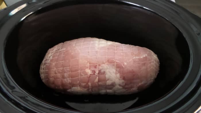 Place thawed turkey roast in crock pot.