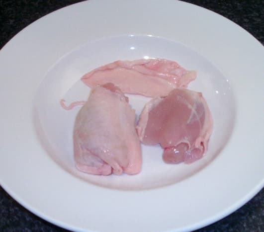 Skin peels easily from chicken thighs