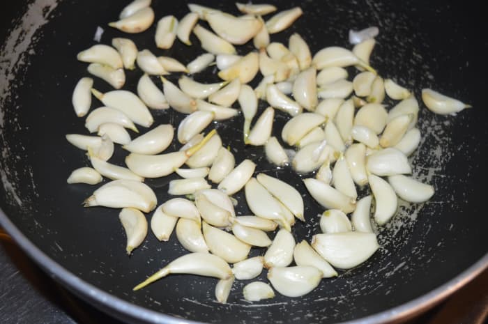 Step one: Saute garlic cloves in very little oil until they become slightly golden. Collect them in a bowl.