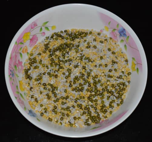 Step one: Wash mung beans, moong dal, and rice. Soak them in fresh water.