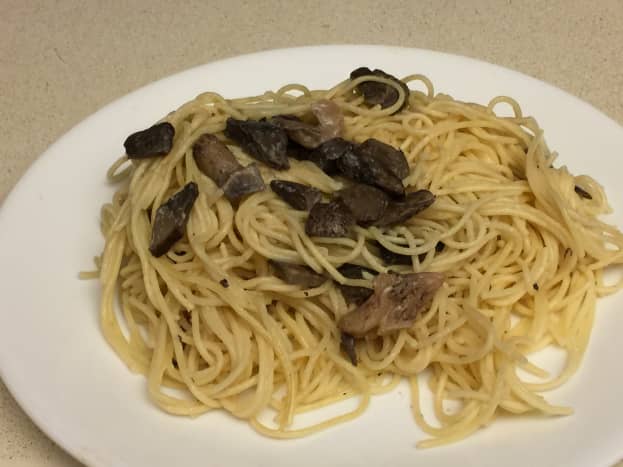 Serving of drunken spaghetti with mushrooms