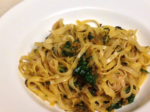 Fettuccine pasta cooked in white wine with sauteed golden beets and greens 