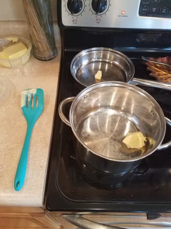 Melt butter into a small saute pan and a large pot.