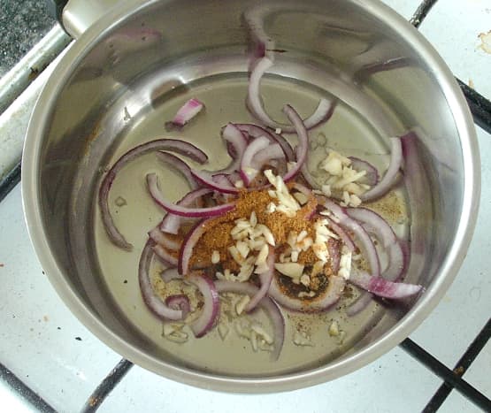 garlic and red onion is gently sauteed in curry powder and oil