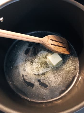Heat cooking oil with butter. 