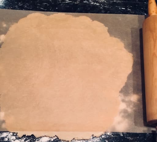 Roll out the dough with wax paper or plastic wrap for easy transfer.