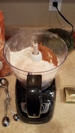 Start by making your pie crusts. Combine flour, sugar and salt in your food processor.
