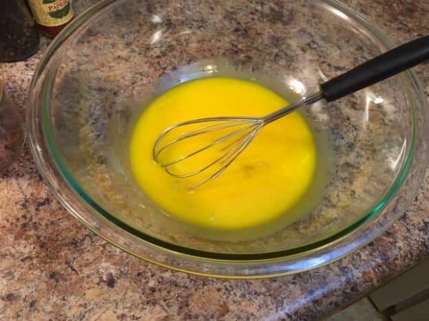 The yolks become bright yellow after you whisk them together. Make sure you don't whisk with too much enthusiasm, as the yolks will start to foam.
