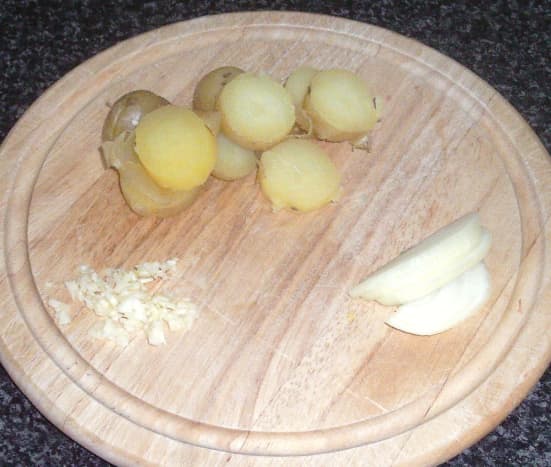 Sliced boiled potatoes, onion and garlic