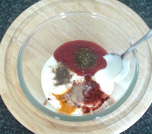 Spicy sauce ingredients are combined in a small bowl