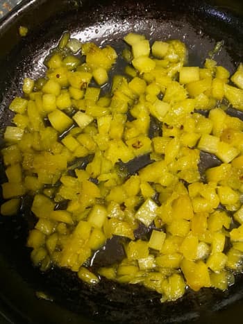 Cook the pineapple in ghee and sugar